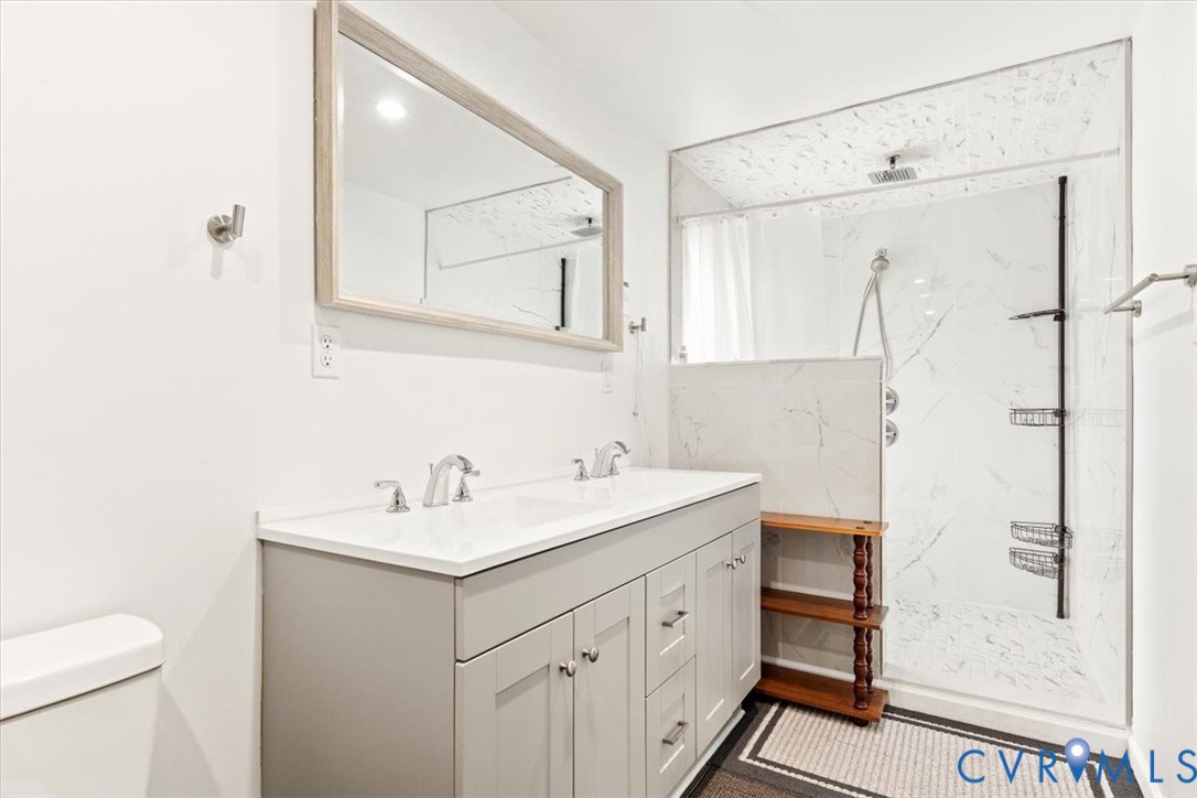 517 West Riverside Drive Lanexa, VA 23089 - Photo 18 of 31 a bathroom with a sink toilet and shower