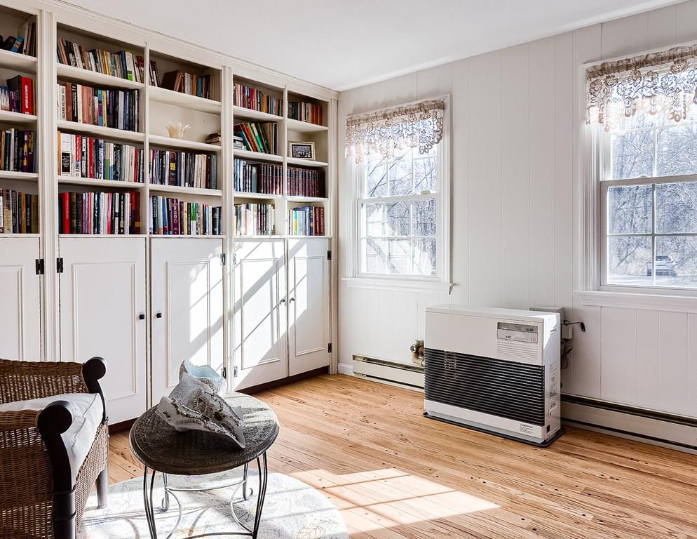 46 Osgood Road Sterling, MA 01564 - Photo 16 of 34 a living room with furniture and a book shelf