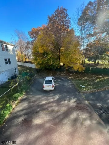 a view of a backyard with trees