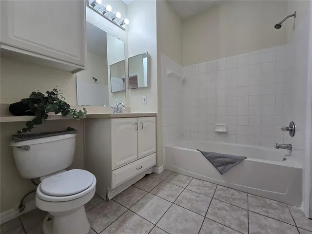 a bathroom with a sink a toilet and bathtub