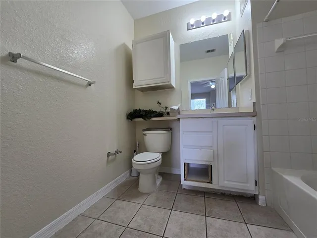 a bathroom with a shower and a sink