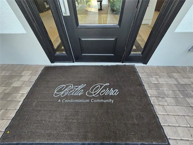 a room with gym equipment and a rug