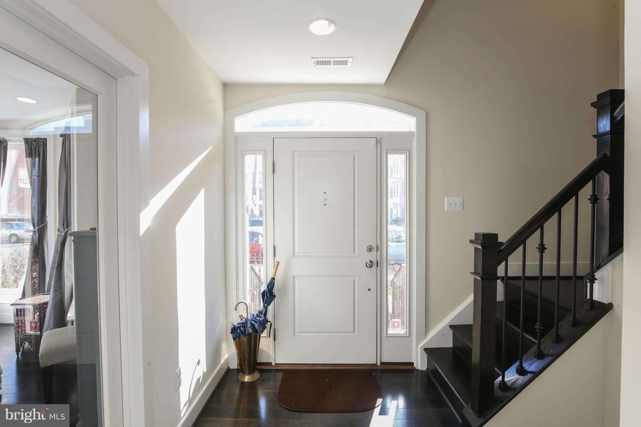 312 L Street Southeast Washington, DC 20003 - Photo 2 of 29 a view of entryway with wooden floor and stairs