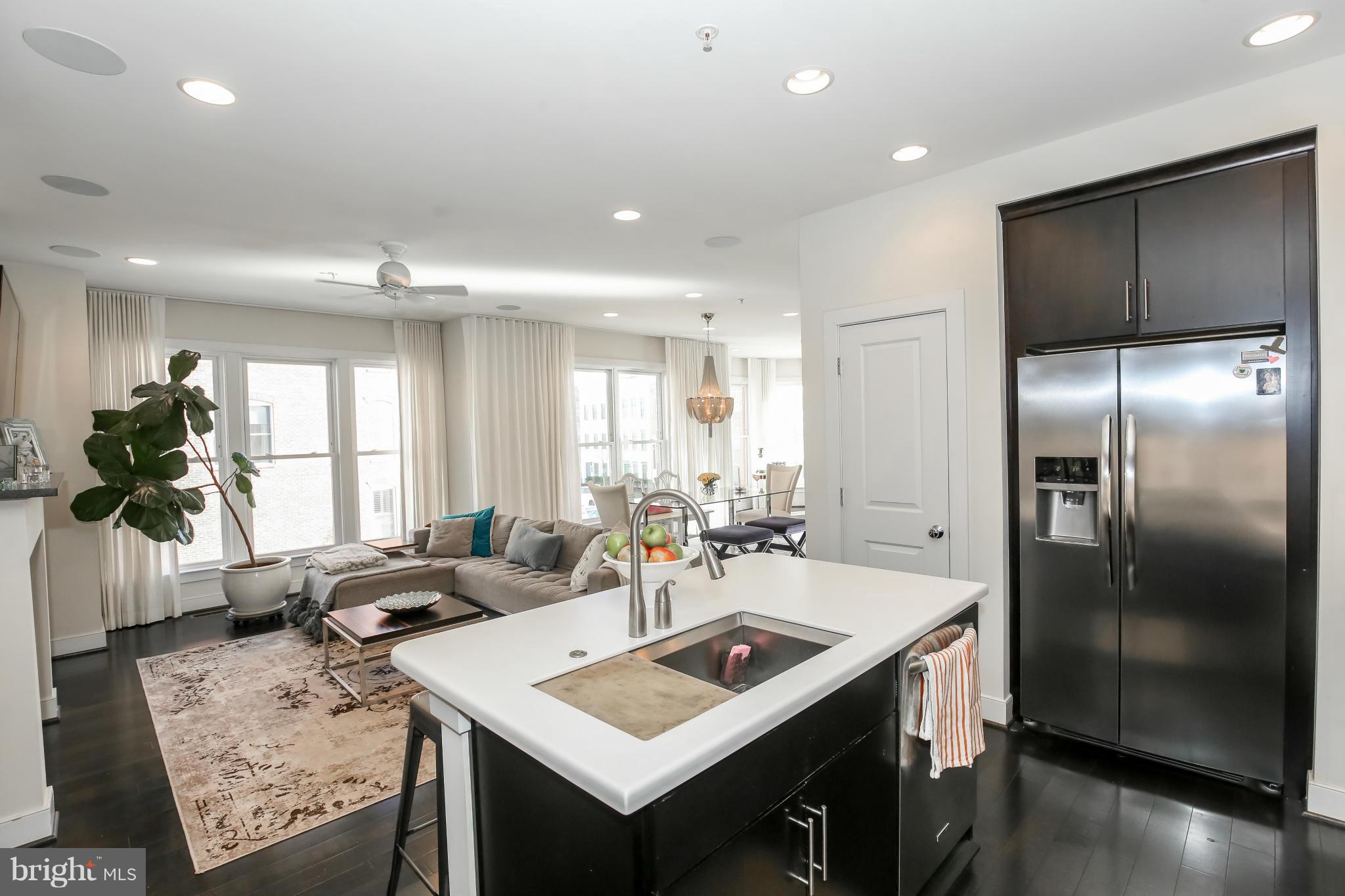 312 L Street Southeast Washington, DC 20003 - Photo 12 of 29 a kitchen with sink refrigerator and window