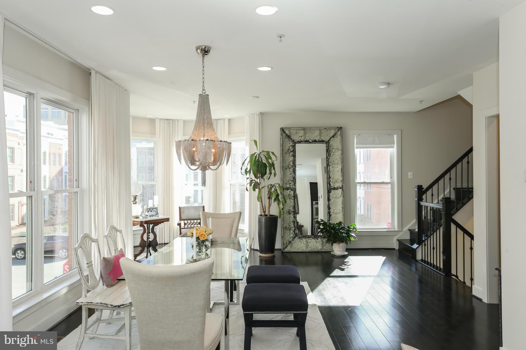 312 L Street Southeast Washington, DC 20003 - Photo 14 of 29 a living room with furniture a large window and wooden floor