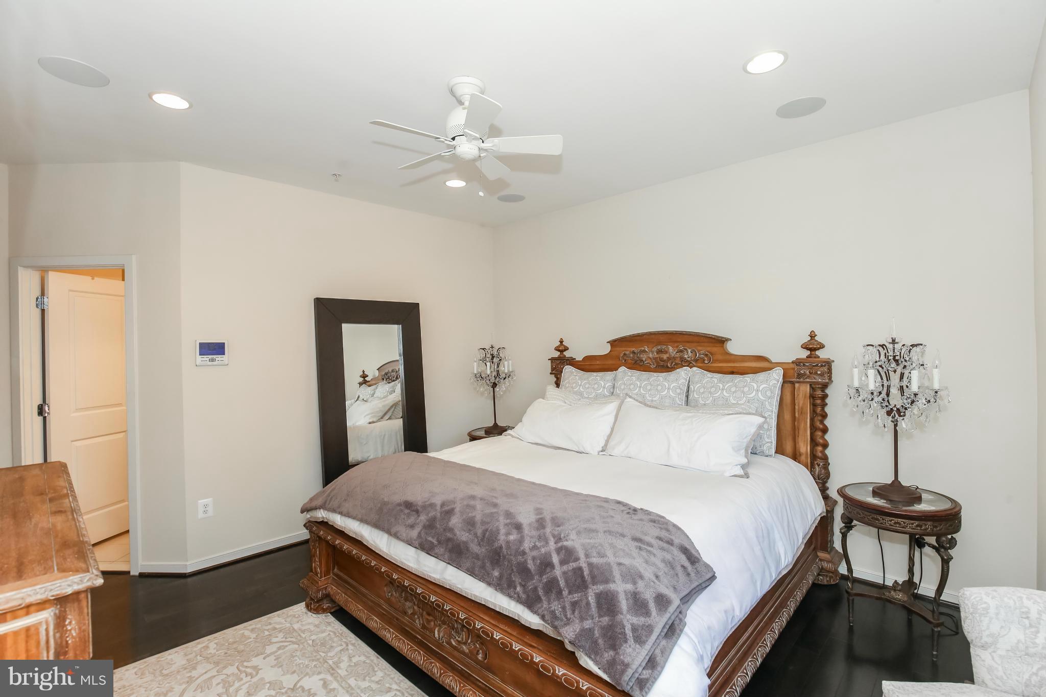 312 L Street Southeast Washington, DC 20003 - Photo 16 of 29 a bedroom with a bed and a chandelier