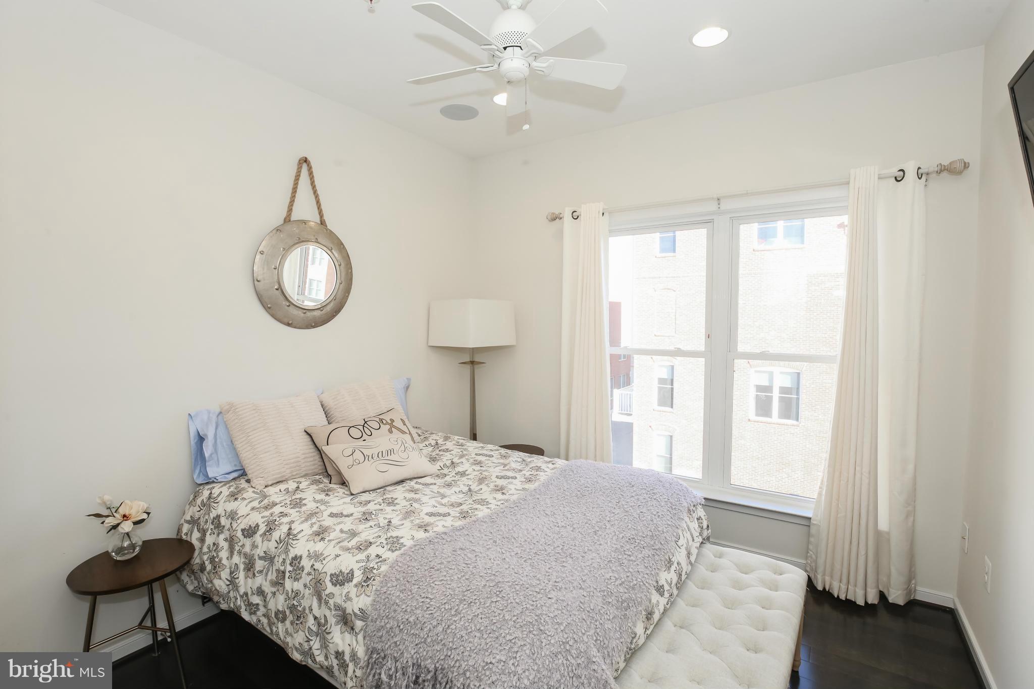 312 L Street Southeast Washington, DC 20003 - Photo 18 of 29 a bedroom with a bed and a window