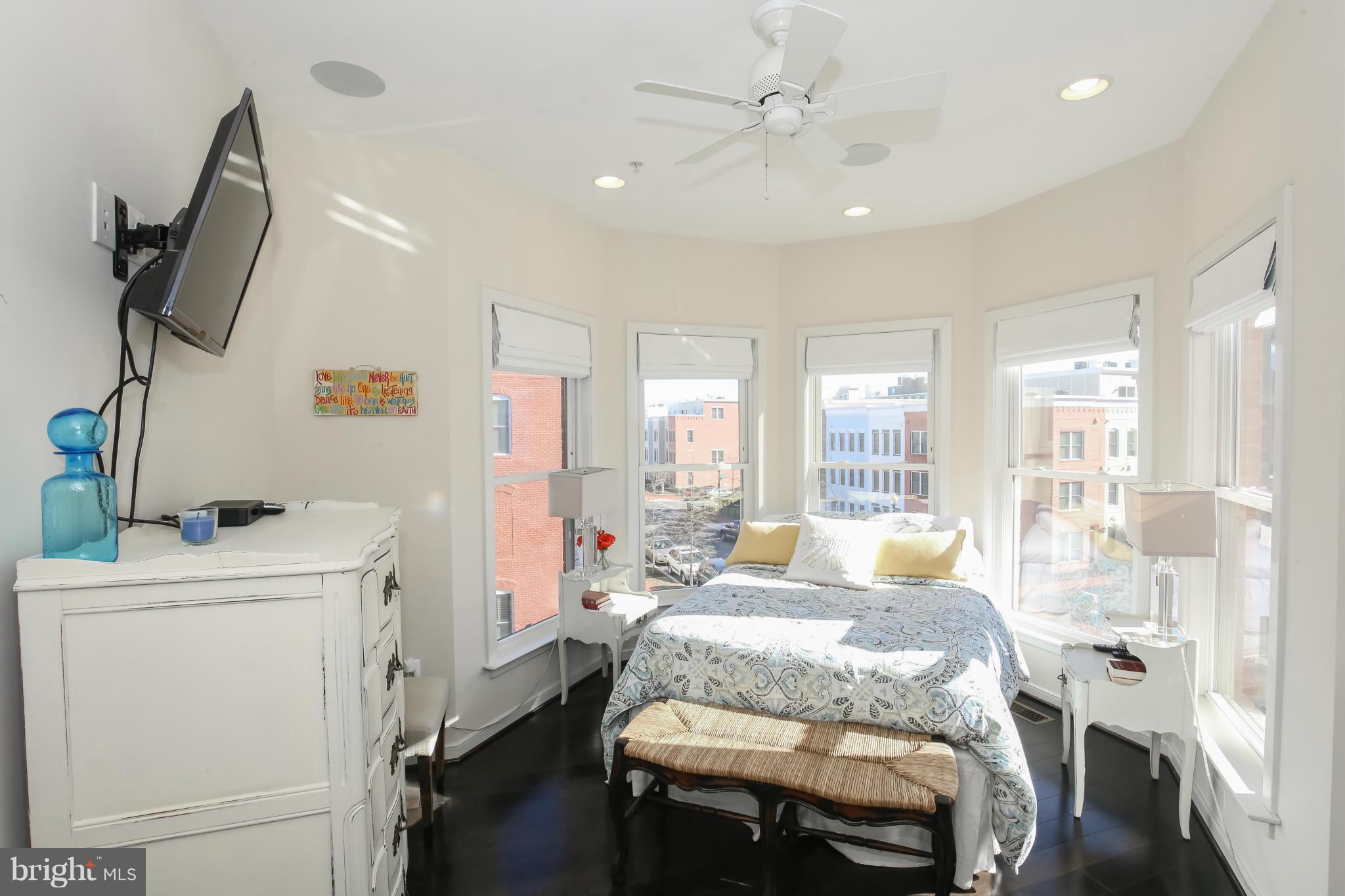 312 L Street Southeast Washington, DC 20003 - Photo 19 of 29 a bed room with a bed window and a television