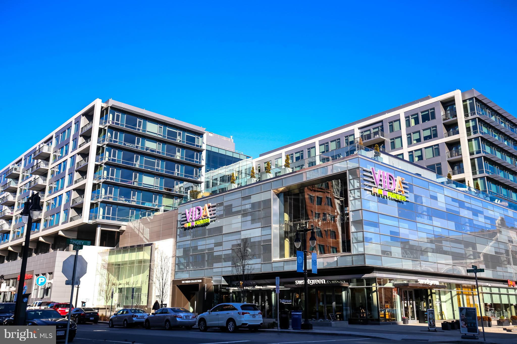 312 L Street Southeast Washington, DC 20003 - Photo 29 of 29 a front view of a building with lot of cars and trees