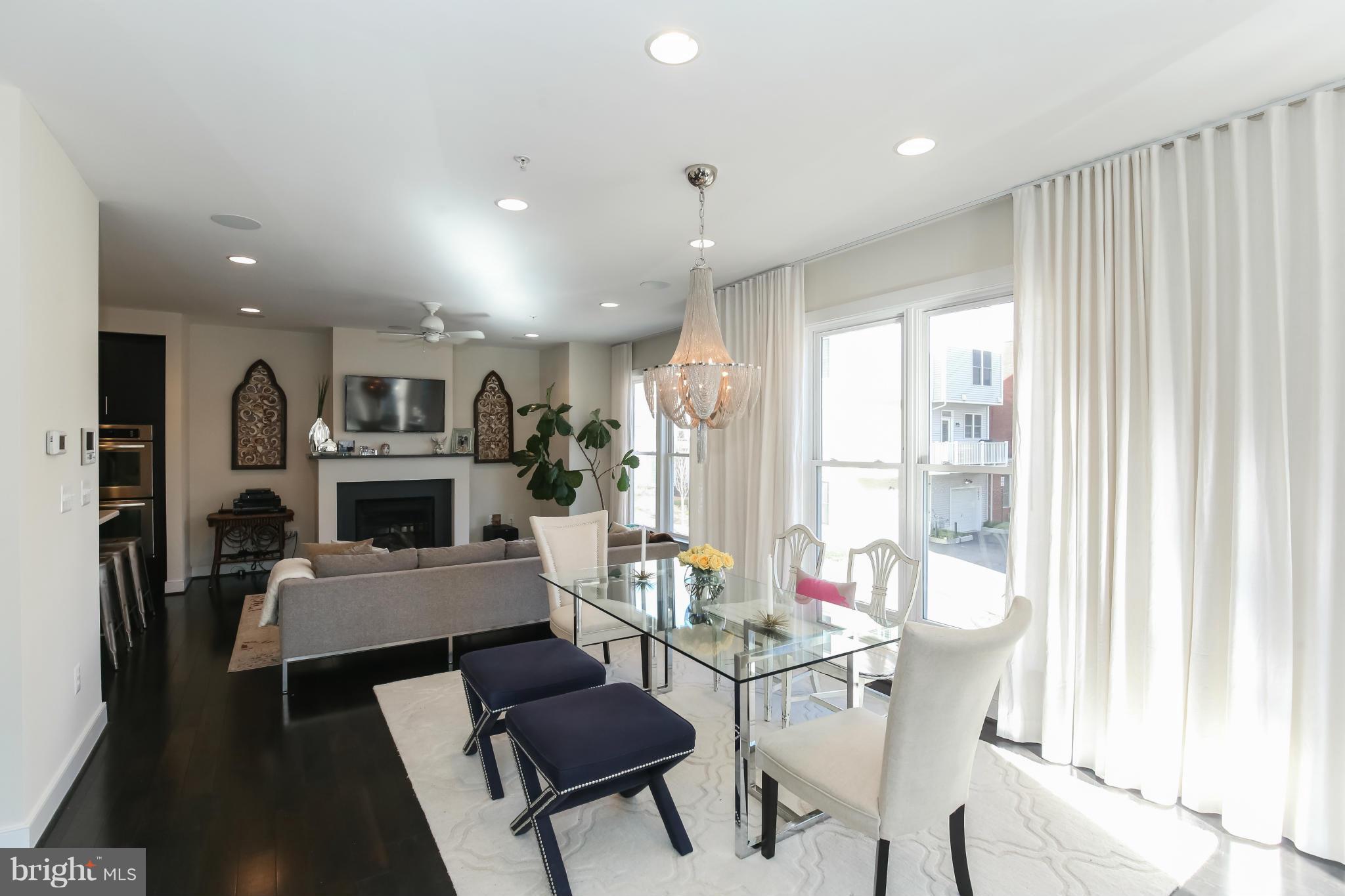 312 L Street Southeast Washington, DC 20003 - Photo 6 of 29 a living room with furniture a fireplace and a table