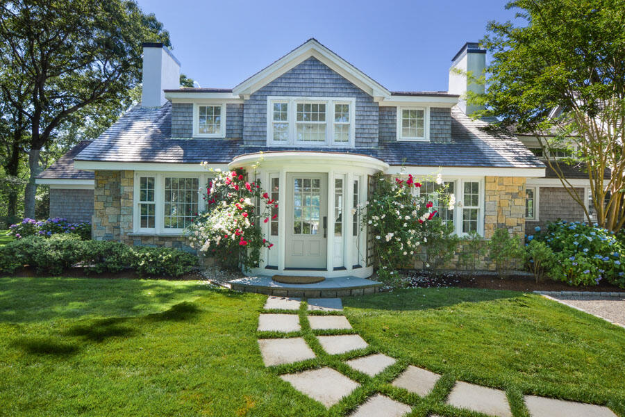 71 Sand Point Osterville, MA 02655 - Photo 9 of 45 a front view of a house with a yard and porch