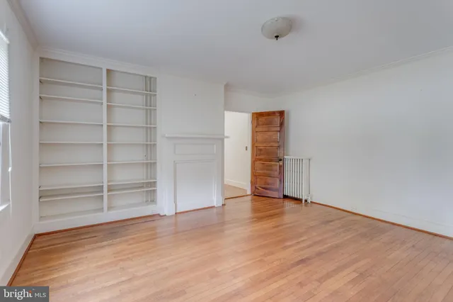 a view of a hallway view with wooden floor and staircase