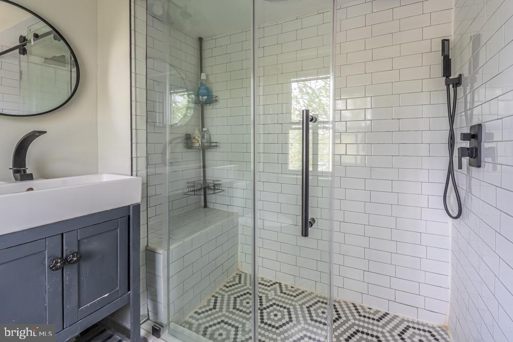 644 Meetinghouse Road Elkins Park, PA 19027 - Photo 30 of 39 Sleek modern shower with chic tiles.