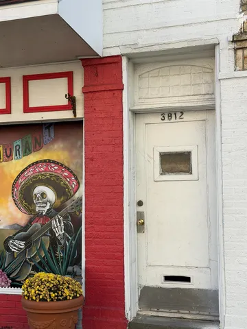 a front view of a house with a white door