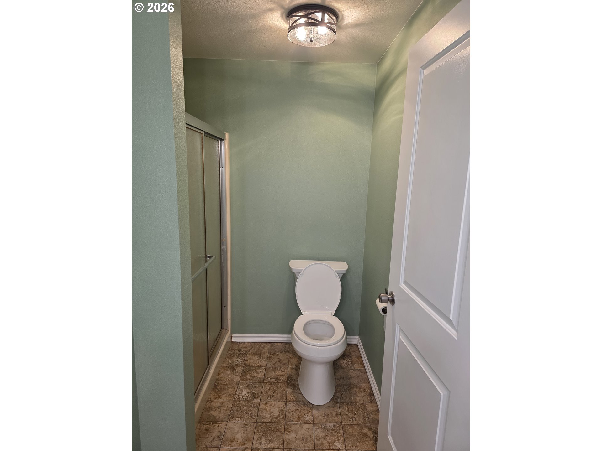 557 South 44th Street Springfield, OR 97478 - Photo 18 of 24 a white toilet sitting next to a bathroom sink