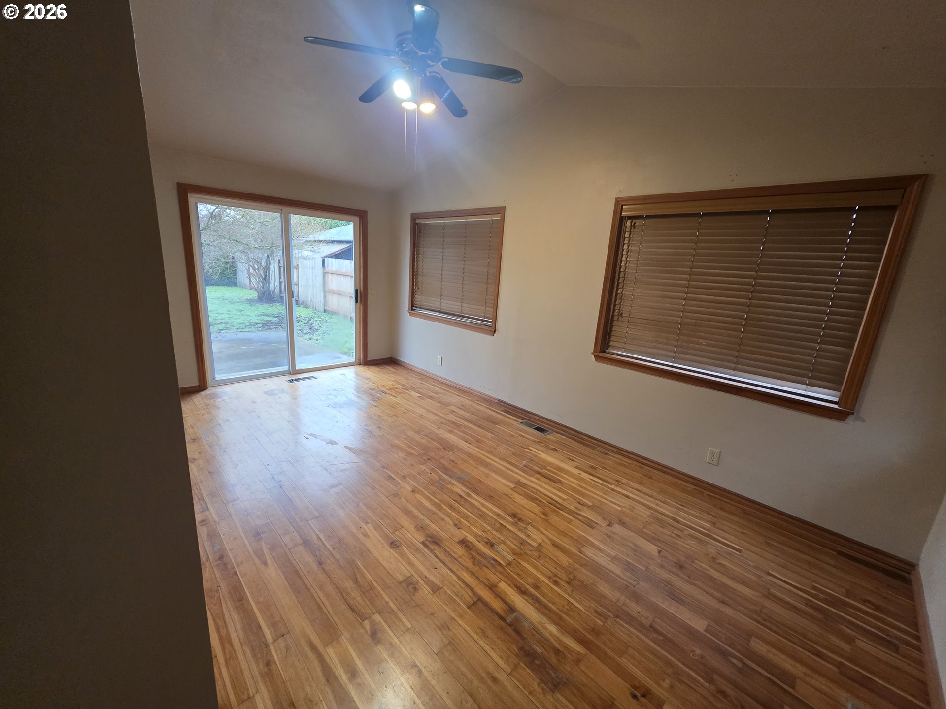 557 South 44th Street Springfield, OR 97478 - Photo 23 of 24 an empty room with wooden floor and windows