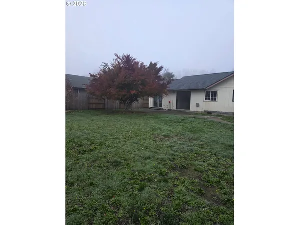 a house view with a garden space