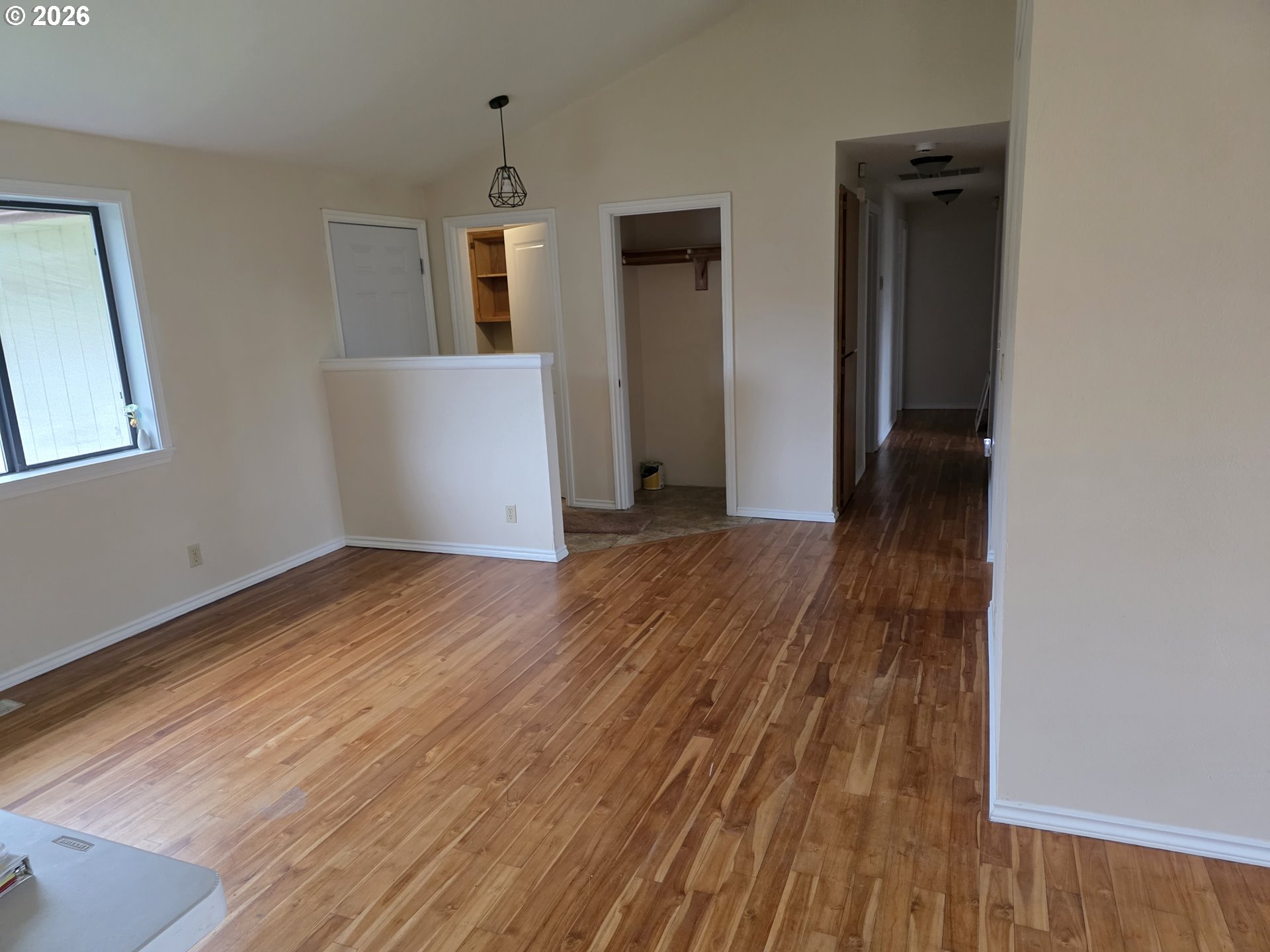 557 South 44th Street Springfield, OR 97478 - Photo 3 of 24 an empty room with wooden floor and windows
