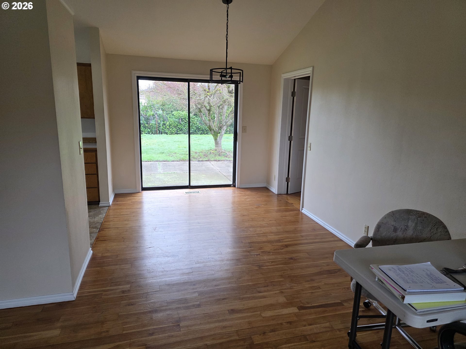 557 South 44th Street Springfield, OR 97478 - Photo 4 of 24 a view of a room with wooden floor and a window