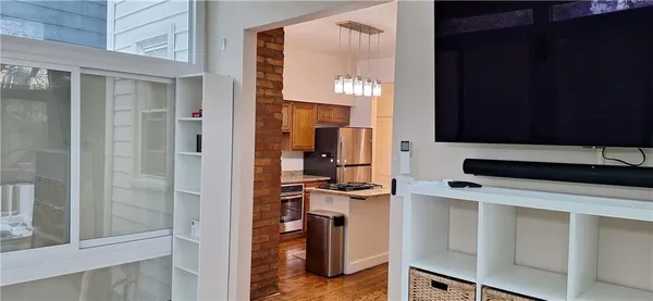a kitchen with a refrigerator and a stove