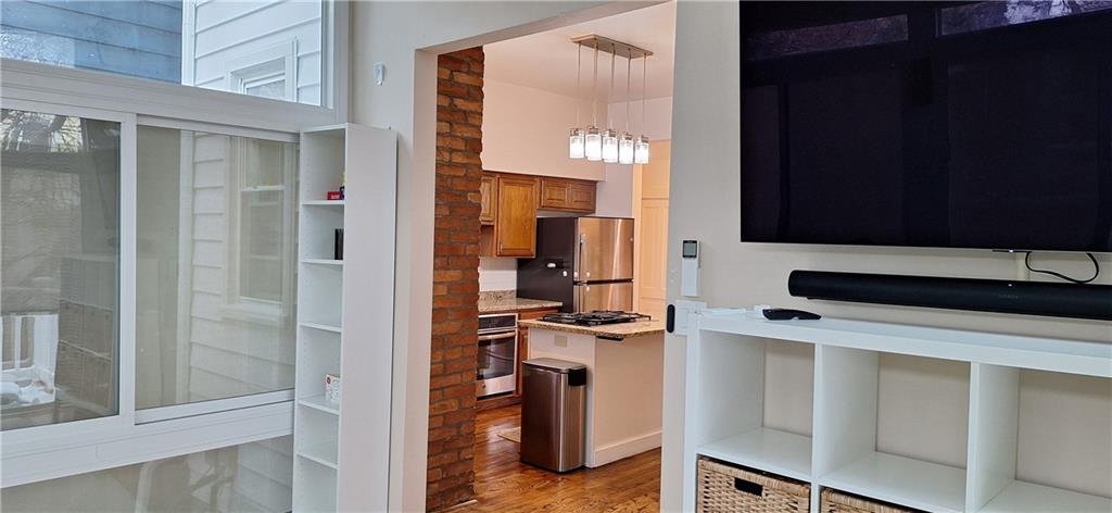 548 South Graham Street Pittsburgh, PA 15232 - Photo 19 of 49 a kitchen with a refrigerator and a stove