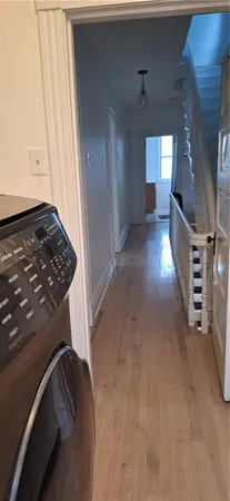 a kitchen with a refrigerator and cabinets