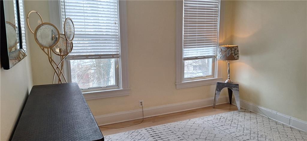 548 South Graham Street Pittsburgh, PA 15232 - Photo 34 of 49 a view of a livingroom with wooden floor and a window