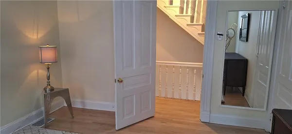 a bathroom with a couch and a rug