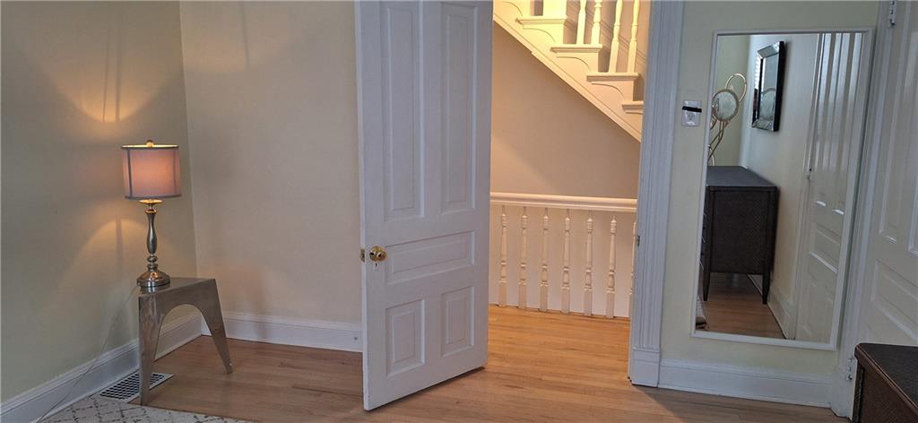 548 South Graham Street Pittsburgh, PA 15232 - Photo 35 of 49 a view of a hallway with wooden floor and staircase