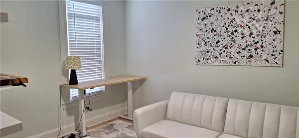 a view of livingroom with furniture and a fireplace
