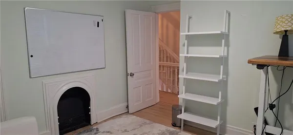 a bathroom with a window and a shower