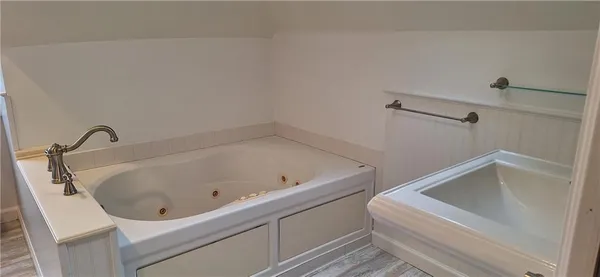 a bathroom with a glass shower door