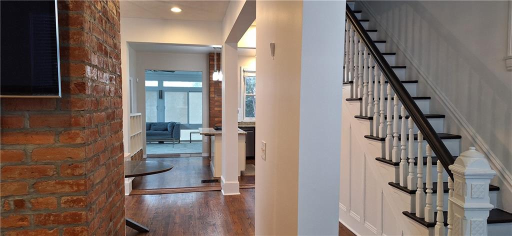 548 South Graham Street Pittsburgh, PA 15232 - Photo 7 of 49 a view of a hallway with wooden floor and staircase