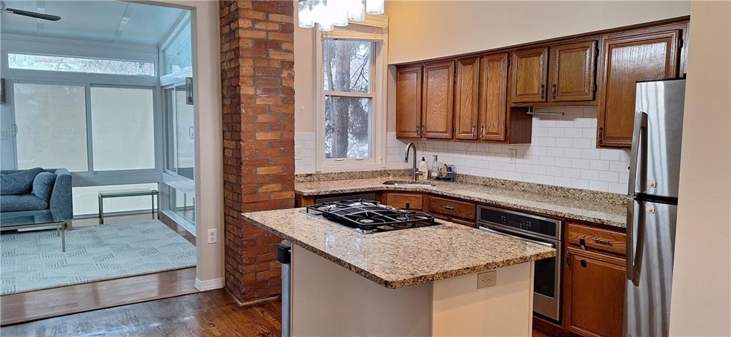 548 South Graham Street Pittsburgh, PA 15232 - Photo 10 of 49 a kitchen with a stove a sink and a refrigerator