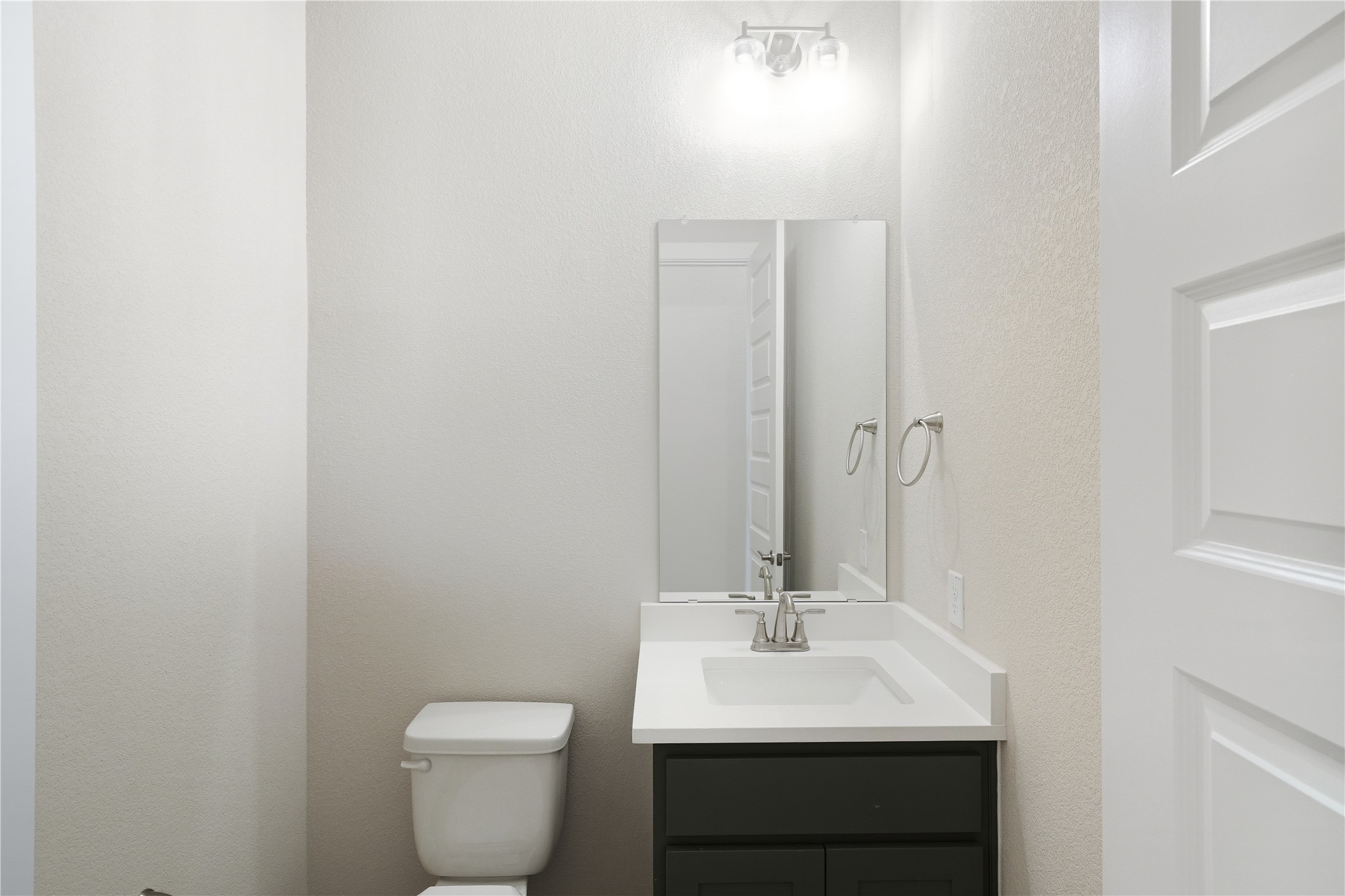 1209 Doelling Drive Georgetown, TX 78633 - Photo 25 of 31 Bathroom featuring vanity and a textured wall
