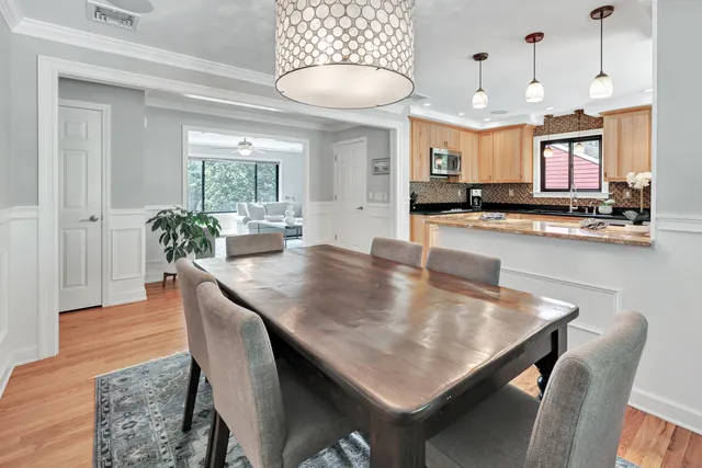 a kitchen with a table and chairs in it