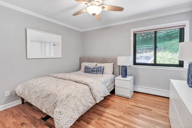 a bedroom with a bed and window