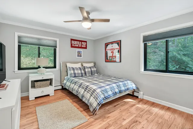 a bedroom with a large bed and a window