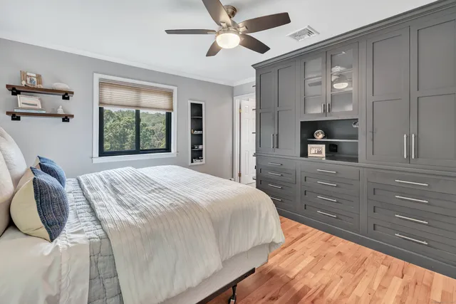 a bedroom with a large bed and a window