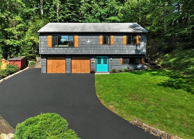 a front view of a house with garden