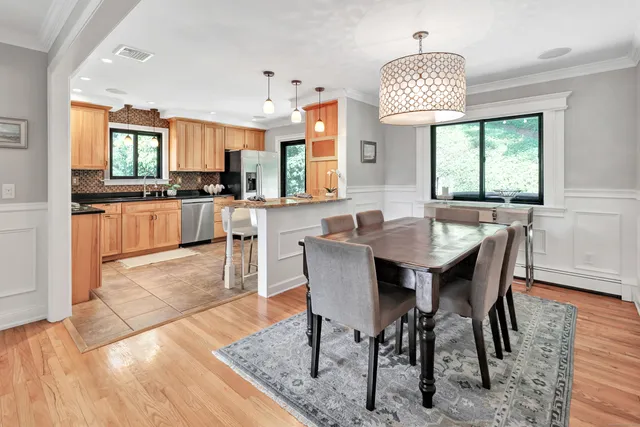 a view of a dining room with furniture window and wooden floor