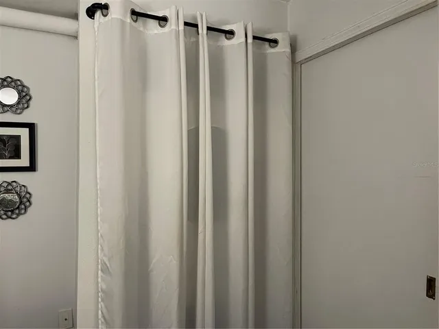 a bathroom with a shower and a tub