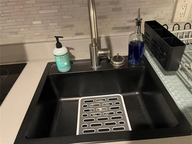 a close view of sink and cabinets