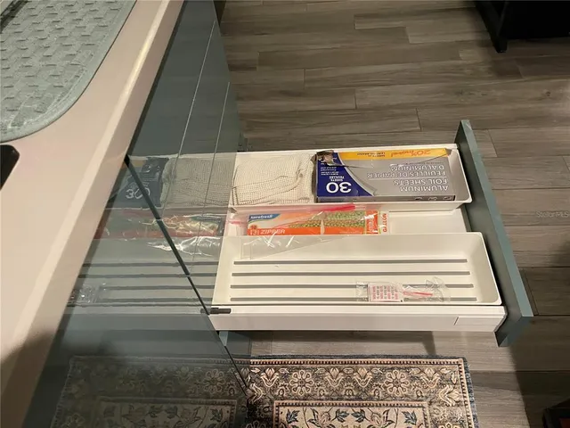 a bedroom with a bed and a mirror