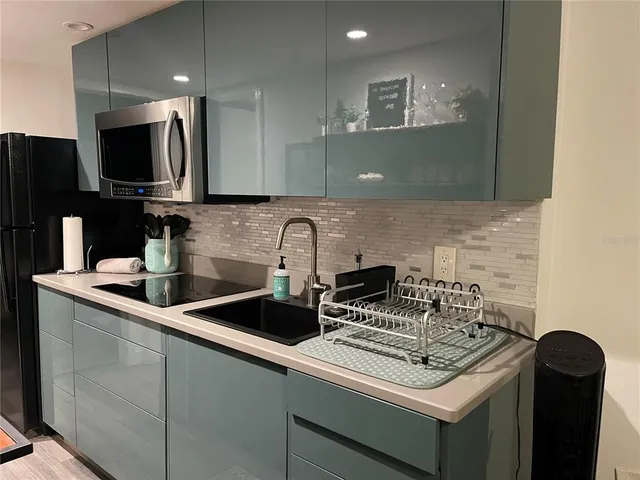 a kitchen with a stove and a microwave