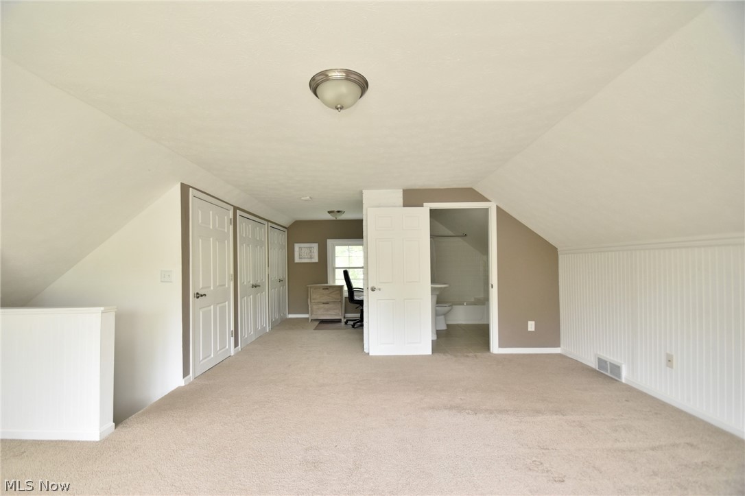 23901 Hazelmere Road Shaker Heights, OH 44122 - Photo 29 of 35 Additional living space featuring lofted ceiling and carpet flooring