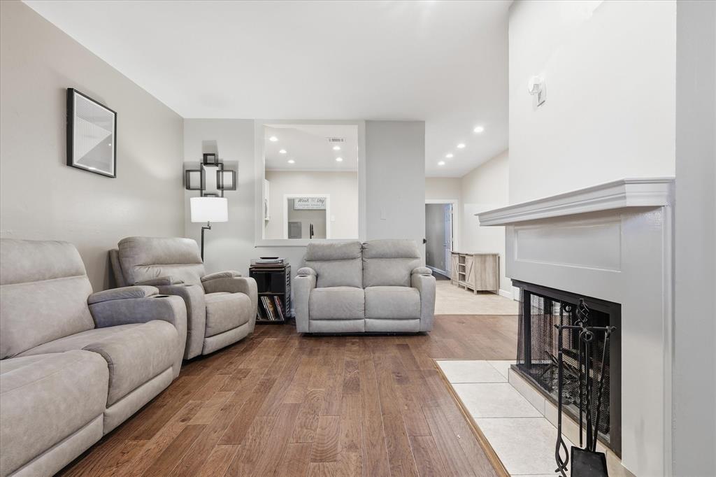 14277 Preston Road, Unit 615 Dallas, TX 75254 - Photo 5 of 20 a living room with furniture and a fireplace