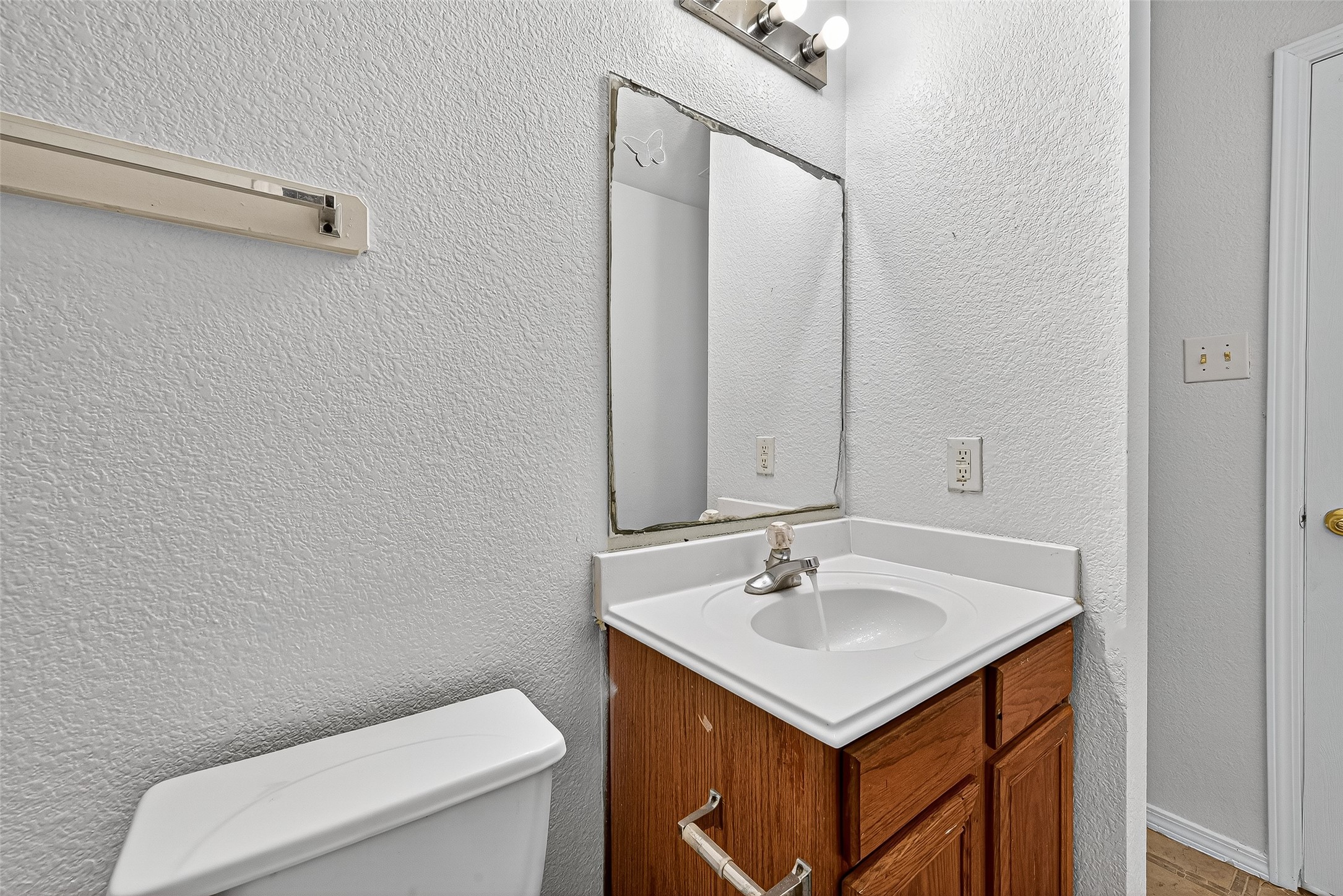 22819 Cabanna Road Spring, TX 77389 - Photo 23 of 26 a bathroom with a sink toilet and mirror