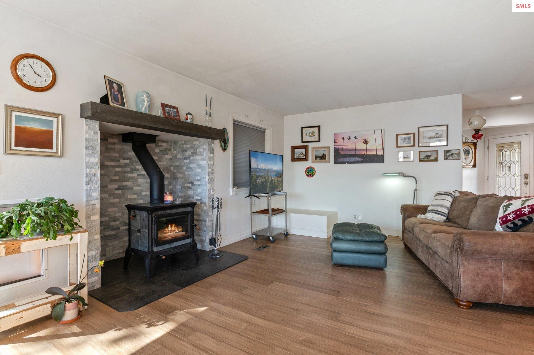 311 School Road Hope, ID 83836 - Photo 37 of 60 Warm up to this cozy fireplace.