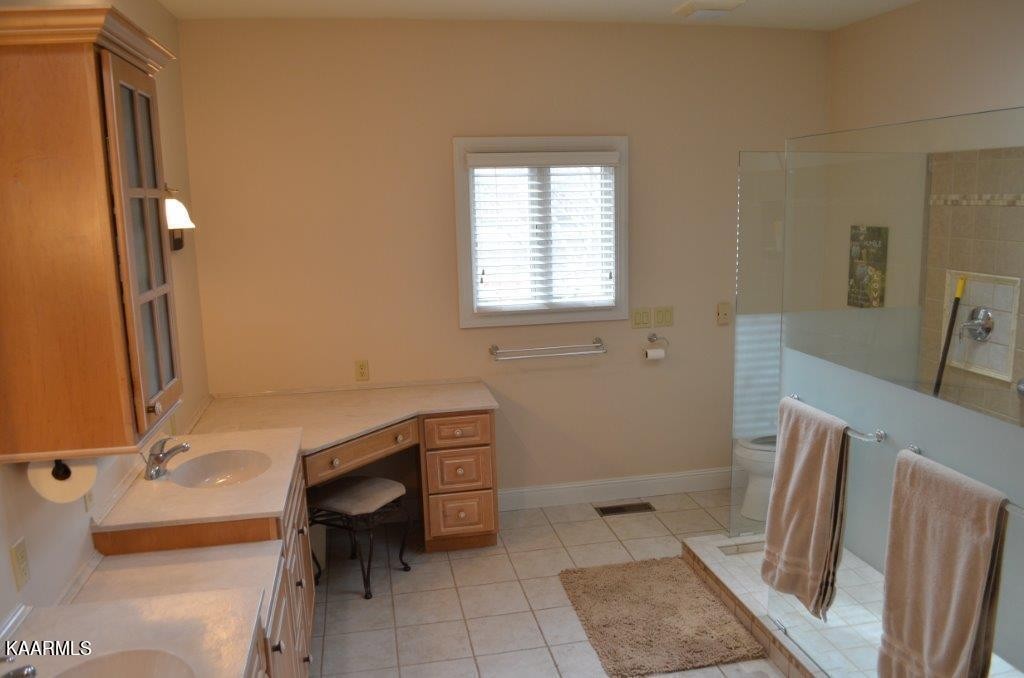13 Hampton Point Crossville, TN 38558 - Photo 13 of 45 a bathroom with a sink a toilet and tub